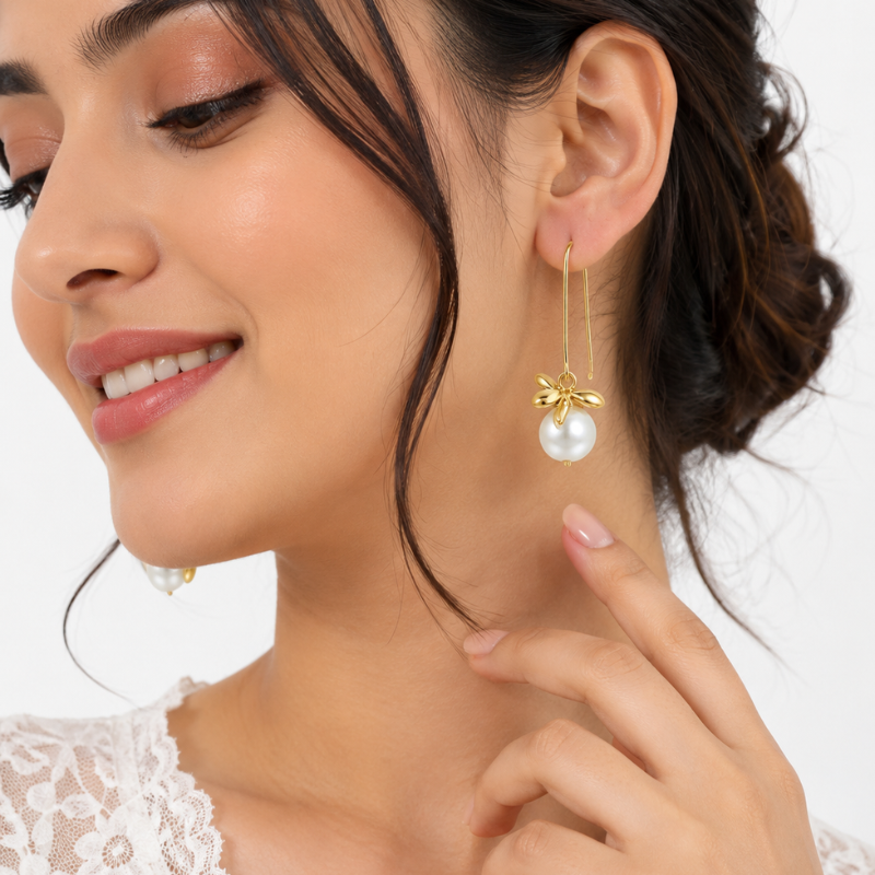 Elegant Gold-Tone Pearl Bow Drop Earrings - Image 2