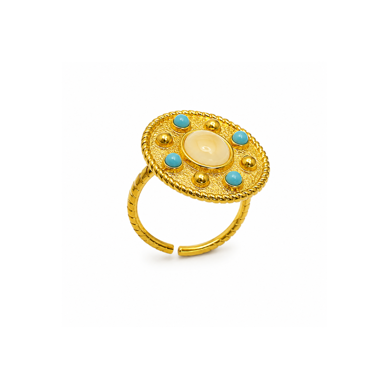 Gold tone adjustable ring with cream center stone and turquoise blue accents