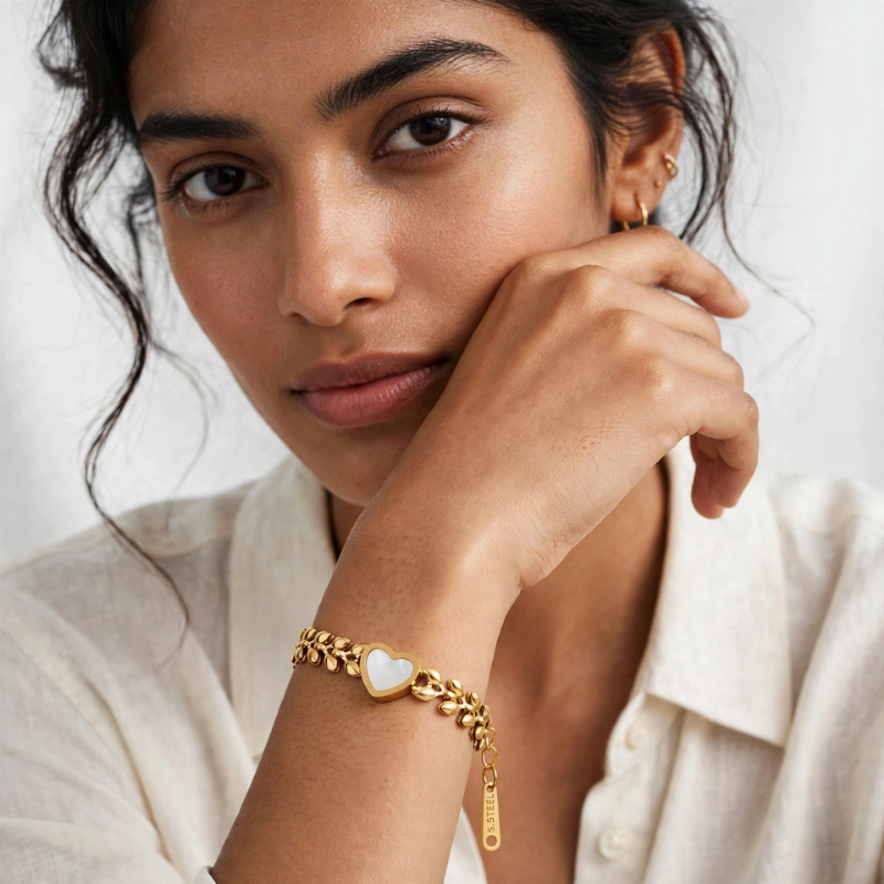 Gold leaf chain bracelet with white heart charm for women