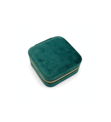 Emerald green velvet jewelry box with golden zipper closed travel case